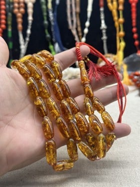 كهرمان عطش  ٣٣ خرزه صنوبري ١٠ مل ٤٠ جرام