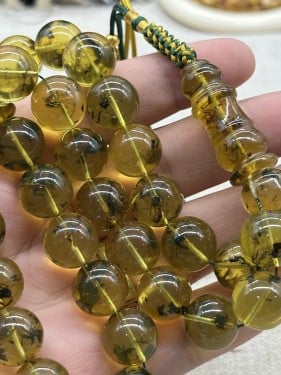 كهرمان بولندي قص دائري فل حشرات ٣٣خرزه ١٣ مل ٤٧ جم