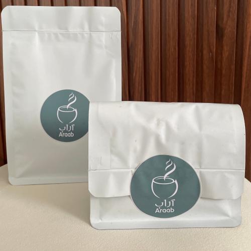 عبوة قهوة مطحونة ساده مع ربع كيلو من قهوة مطعمة بالهيل والزعفران