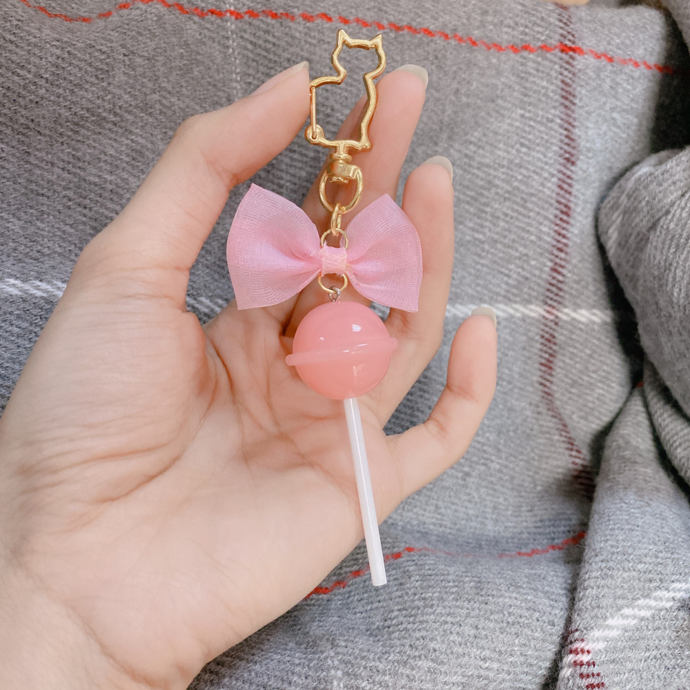 ميدالية مفاتيح بشكل lollipop- وردي باستيل