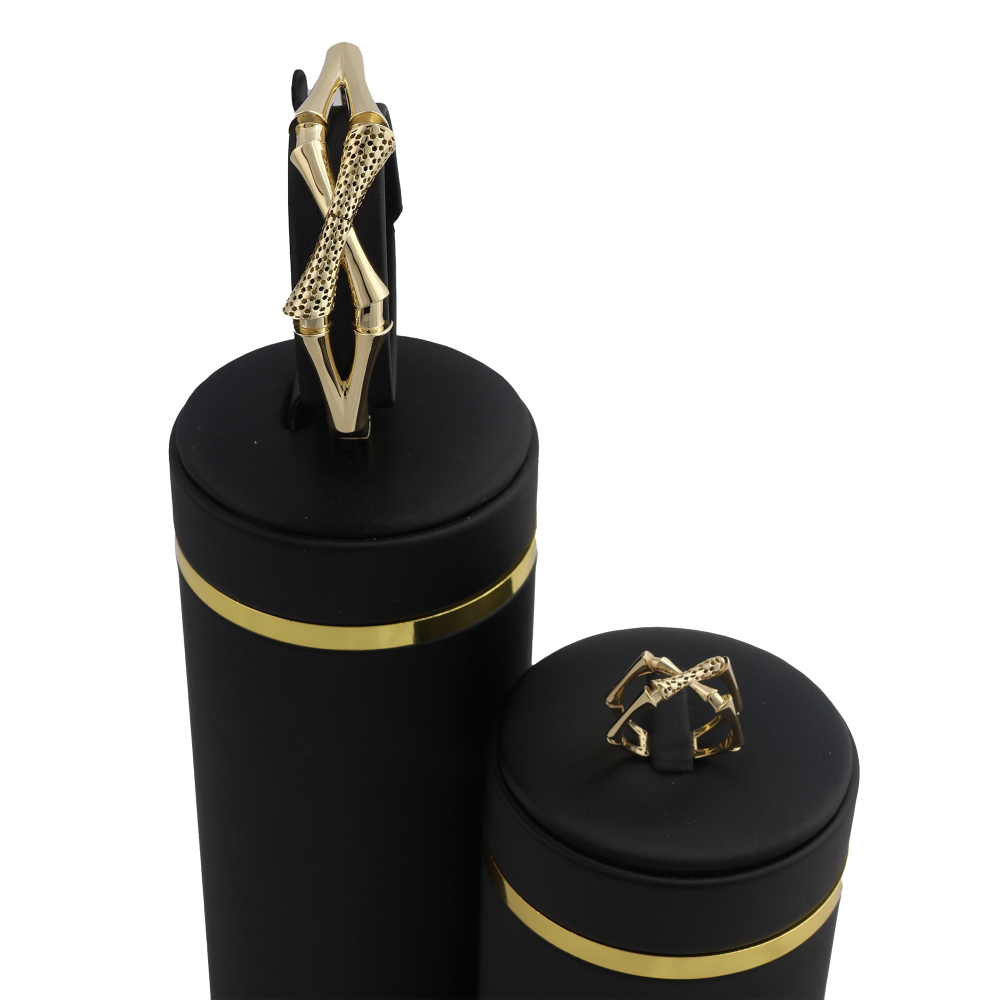 طقم البامبو المتقاطع اسوارة وخاتم عيار 18 وزن 14.7 جرام - شذور الذهب