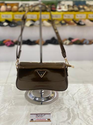 شنطة صغيرة بني غامق لامع 16953