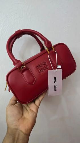 شنطة صغيرة عنابي مطفي 7070