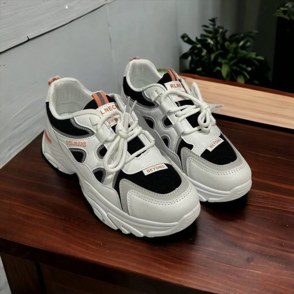 White, black and orange shoes by Rlnecm, made of fabric and leather - BELORN