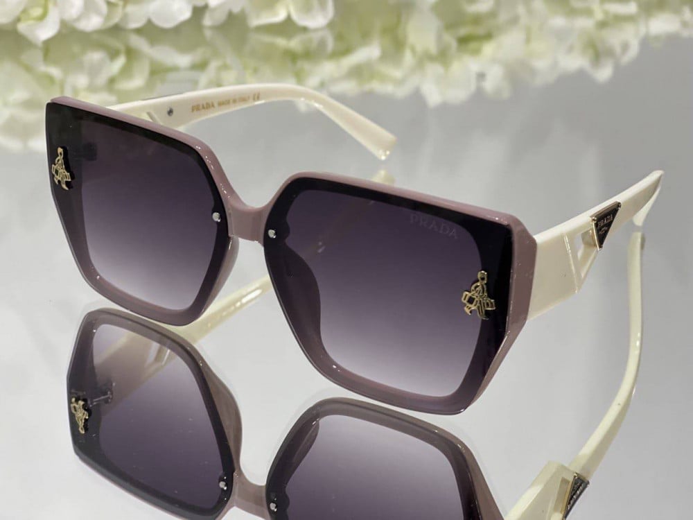 Prada sunglasses with pink and white square frames and transparent pink  lenses