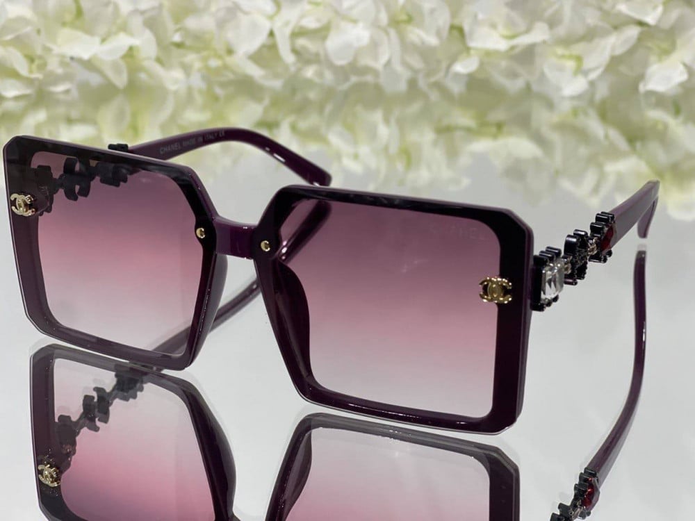 Chanel sunglasses with square-shaped dark pink textured frames and pink  lenses