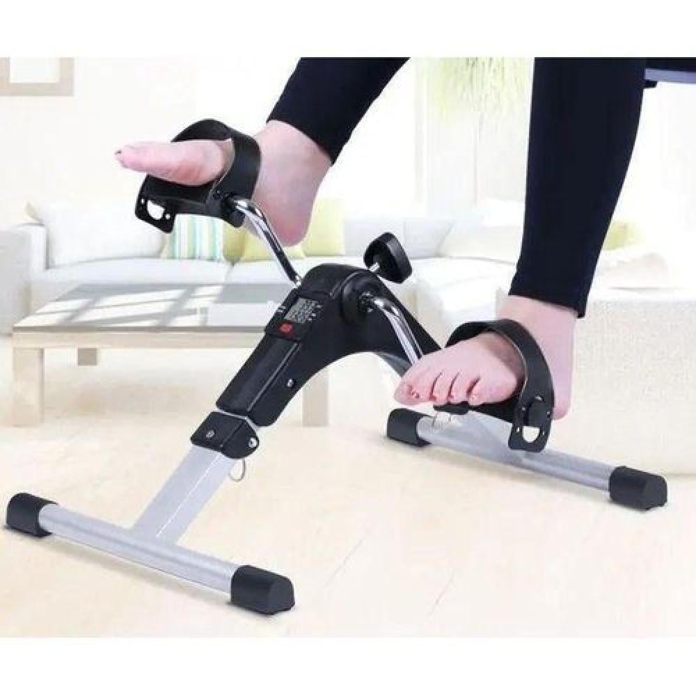 استخدام جهاز البدال لتمارين الساقين أثناء الجلوس