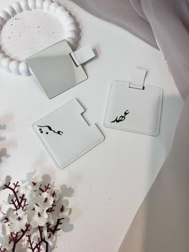 توزيعات مرايا جلد بالاسم