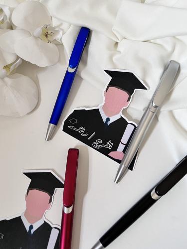 توزيعات ثيم التخرج مع قلم