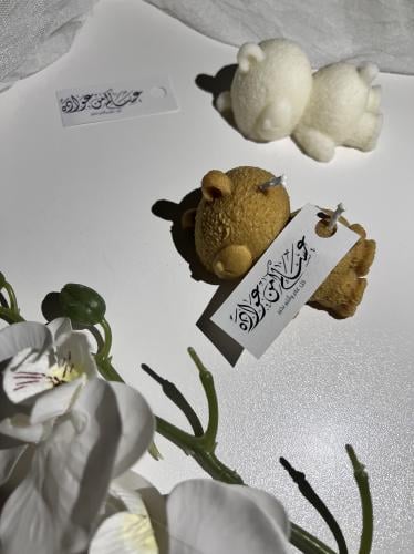 شمعة الدب النائم مع ثيم العيد
