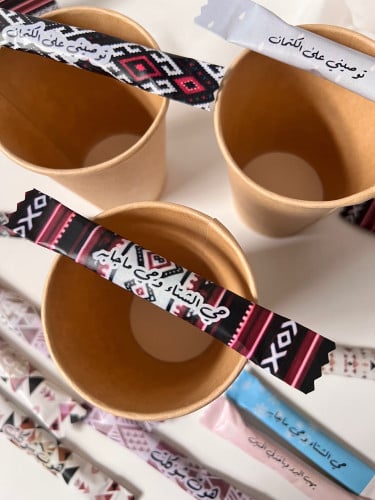 توزيعات كوب شاي مع مغلف سكر