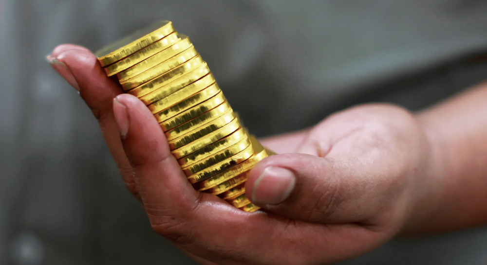 الاستثمار في أونصة الذهب: دليلك لمعرفة سعر أونصة الذهب والتداول بالذهب بثقة