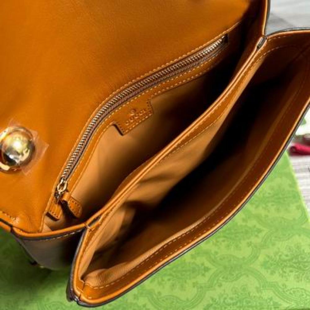 شنطة قوتشي بني