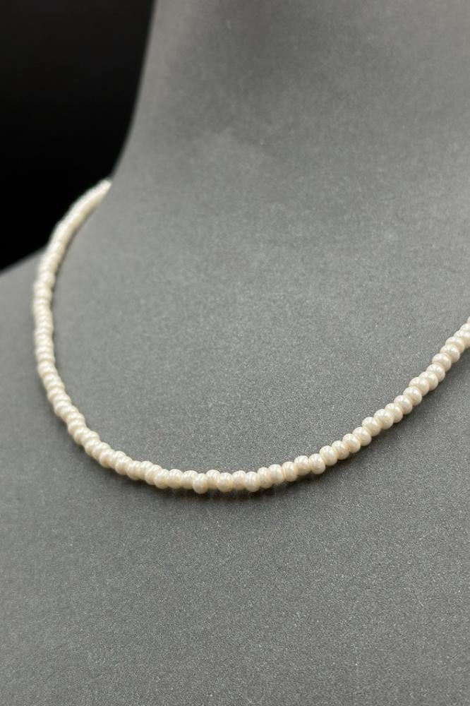 عقد لؤلؤ مع ذهب عيار 18 وزن من 0.18 الى 0.19 جرام