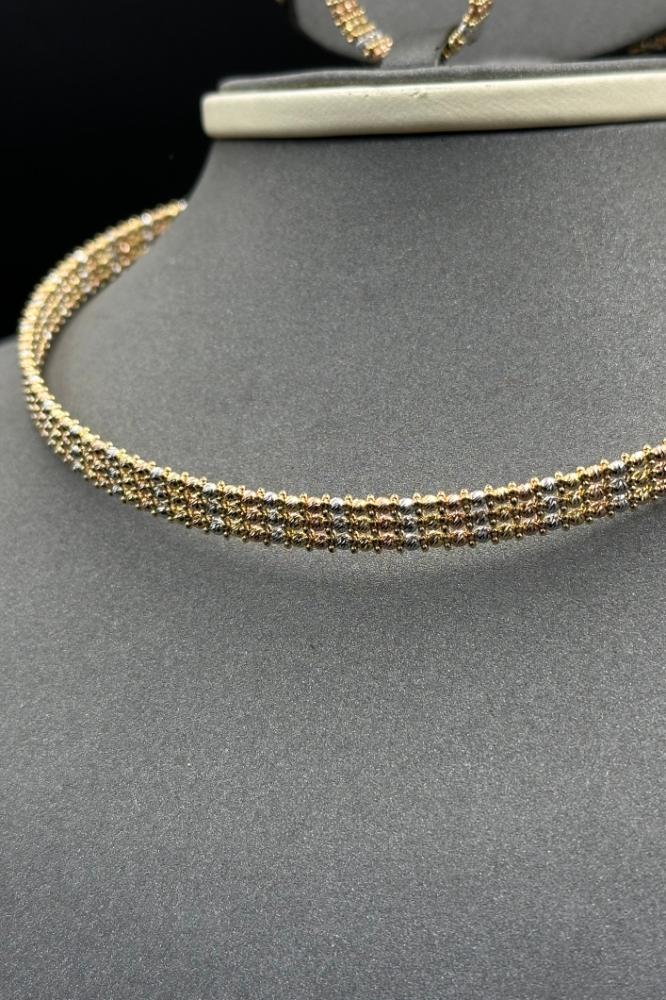 طقم كور ليزر ذهب صافي ملون عيار 18 وزن 35.2 جرام لاطلالة فريدة