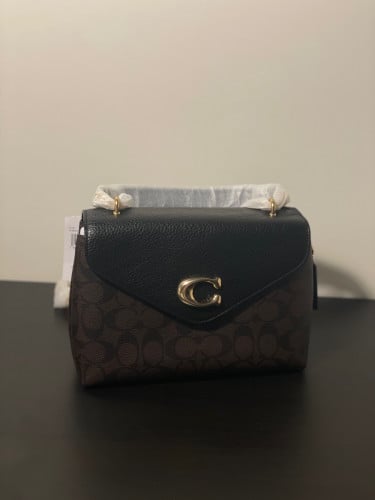 شنطه كوتش بني