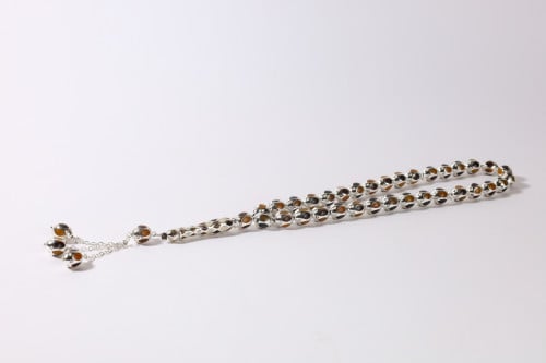 سبحة قفص 33 حبة بيضاوي مع عاج  وكهرمان