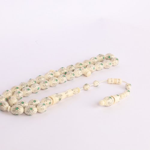 عاج بالذهب والزمرد