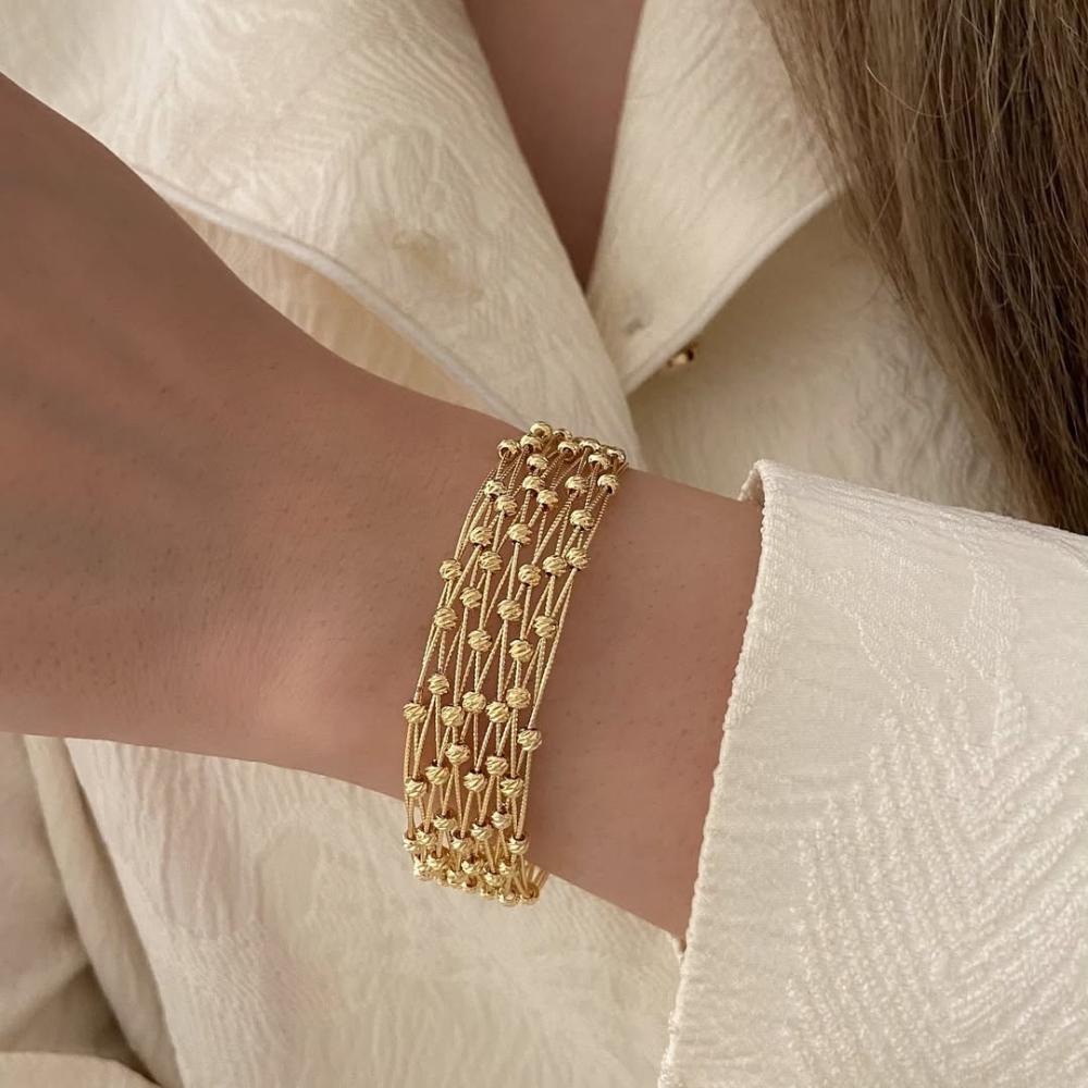 طقم إسوارة مع خاتم بتصميم مميز متشابك مع كرات ذهبيه مطلية دقة الذهب .. موديل JR-100