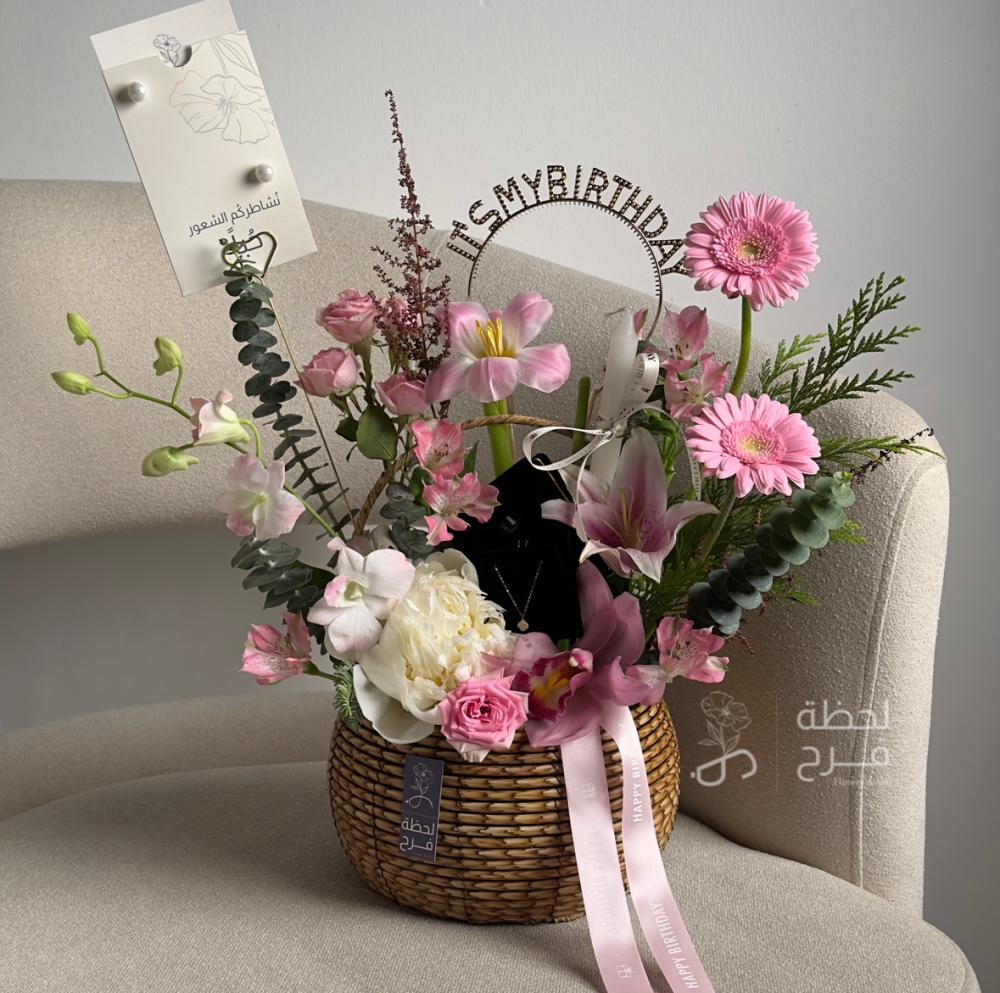 Basket of flowers and gold chain