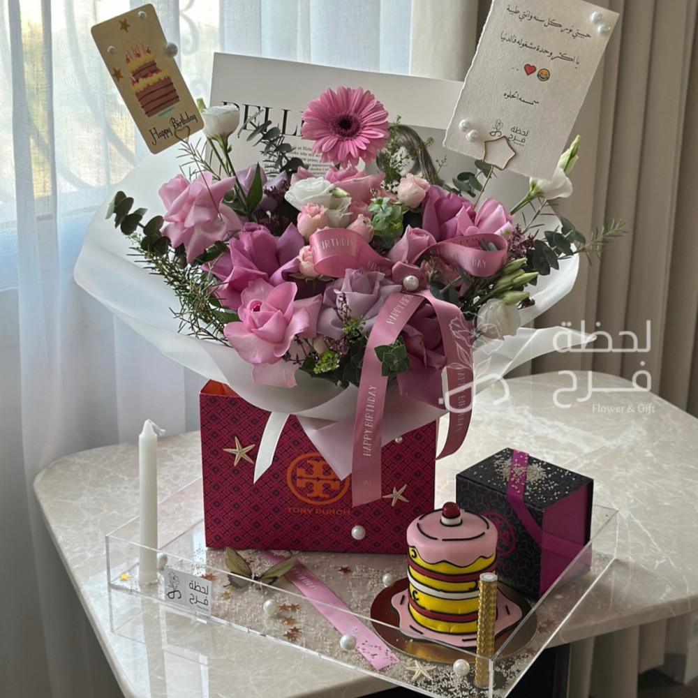 Bella's birthday stand and Tory Burch earrings