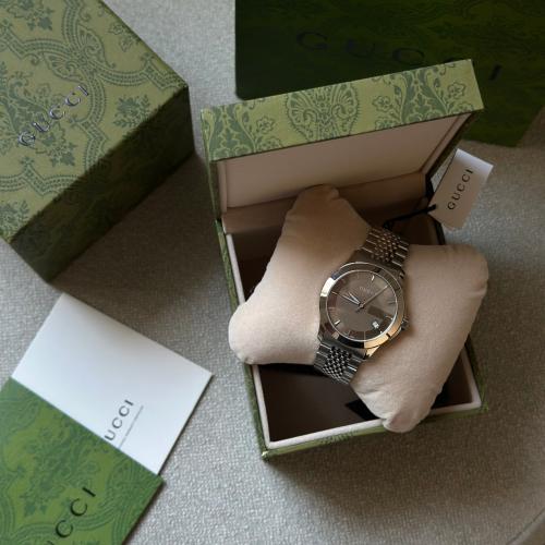 ساعة قوتشي مينا عسلي - Gucci watch with honey dial