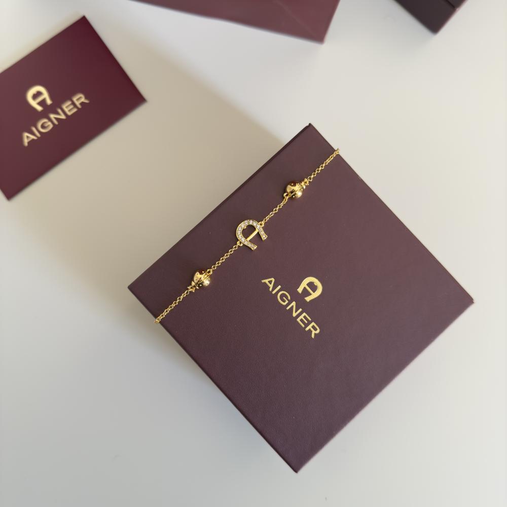 Aigner gold bracelet with logo