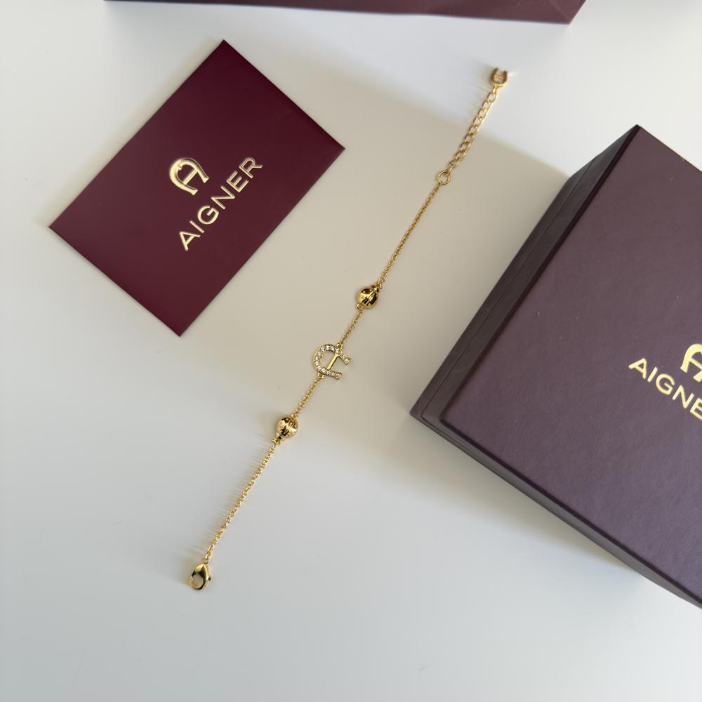 Aigner gold bracelet with logo