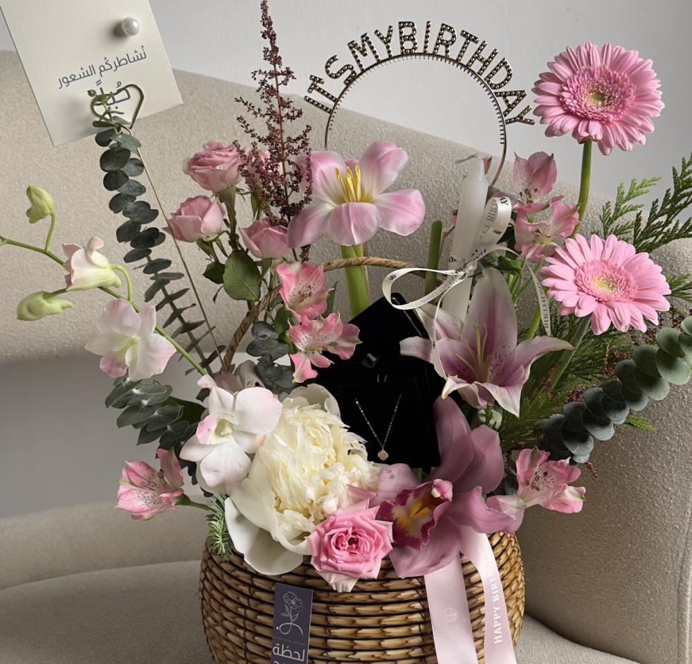 Basket of flowers and gold chain