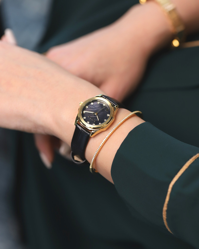 Tala watch with a black leather strap