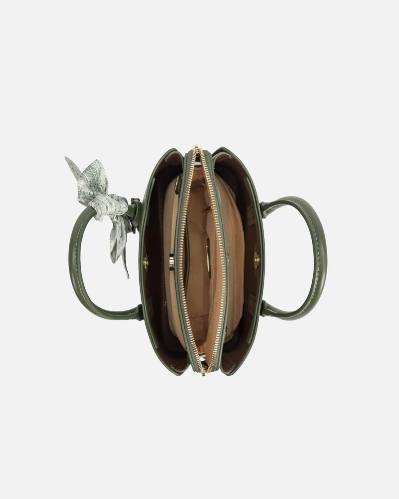 A women's bag of green leather