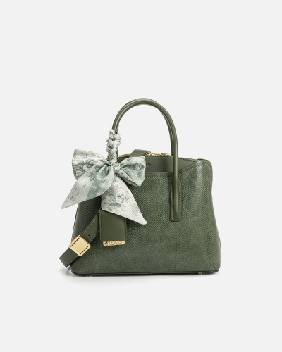 A women's bag of green leather