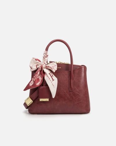 A women's bag of burgundy leather