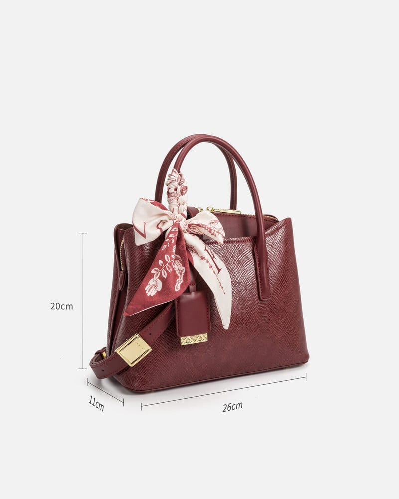 A women's bag of burgundy leather