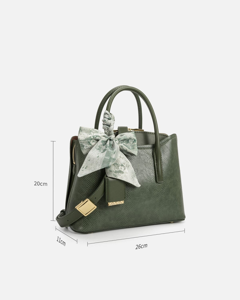 A women's bag of green leather