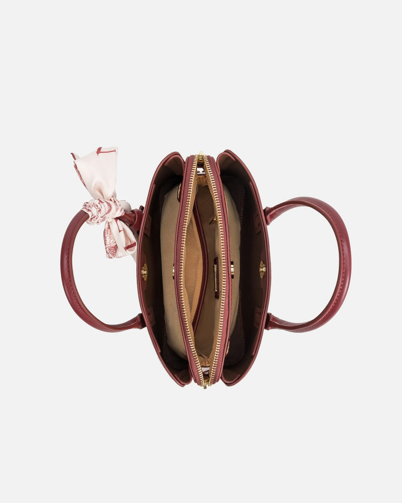 A women's bag of burgundy leather
