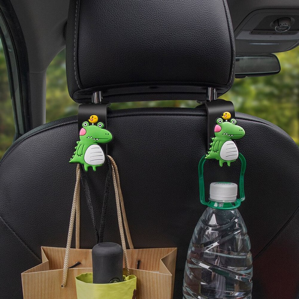 The 2pcs Universal Car Headrest Hook is a cute couple car hanger that can be used to hang and store items such as clothes in a car.