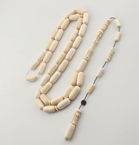 سبحه من عاج الفيل, 37 خرزه صنوبري 6.5 في 15 ملم وشاهد منقوش.