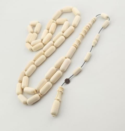 سبحه من عاج الفيل, 39 خرزه صنوبري 6.5 في 15 ملم وشاهد منقوش.