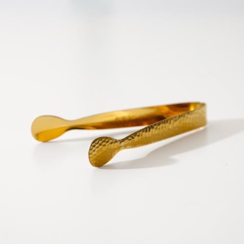 ملقاط الفحم و العود ذهبي اللون