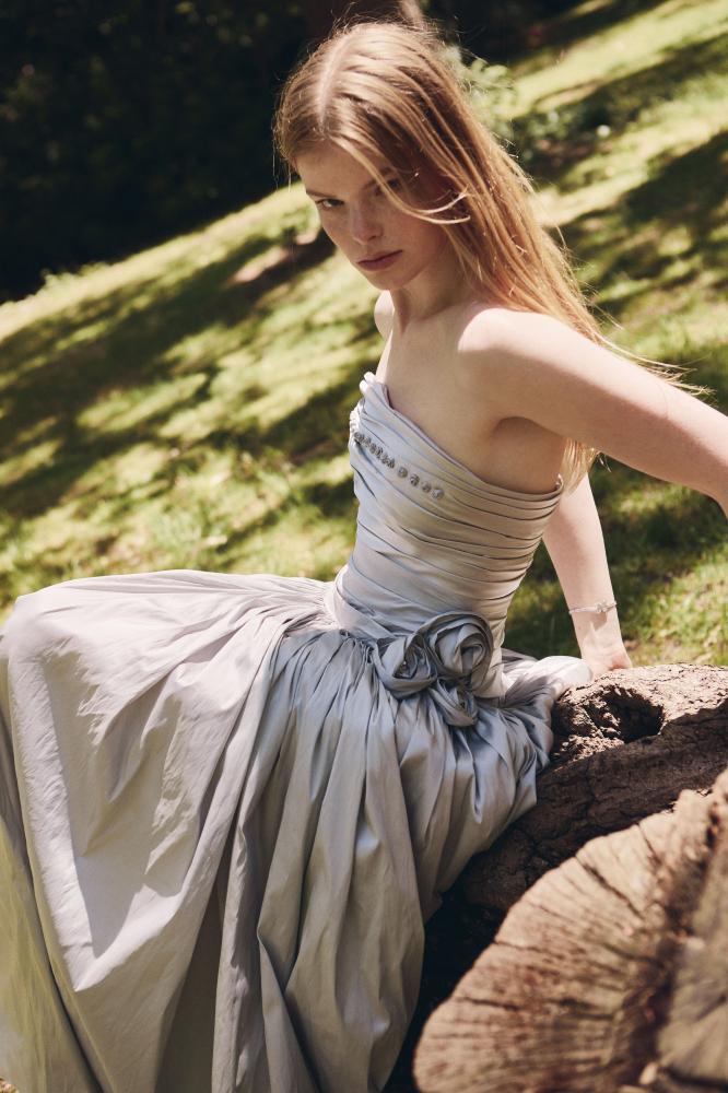 grey taffeta dress Silver Shantung ball gown featuring a strapless draped bodice, hand-pleated full skirt, and handcrafted floral accents at the waist colorful formal dresses